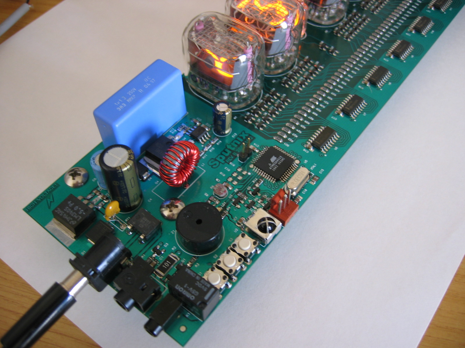 Nixie clock board with high-voltage section and microcontroller
