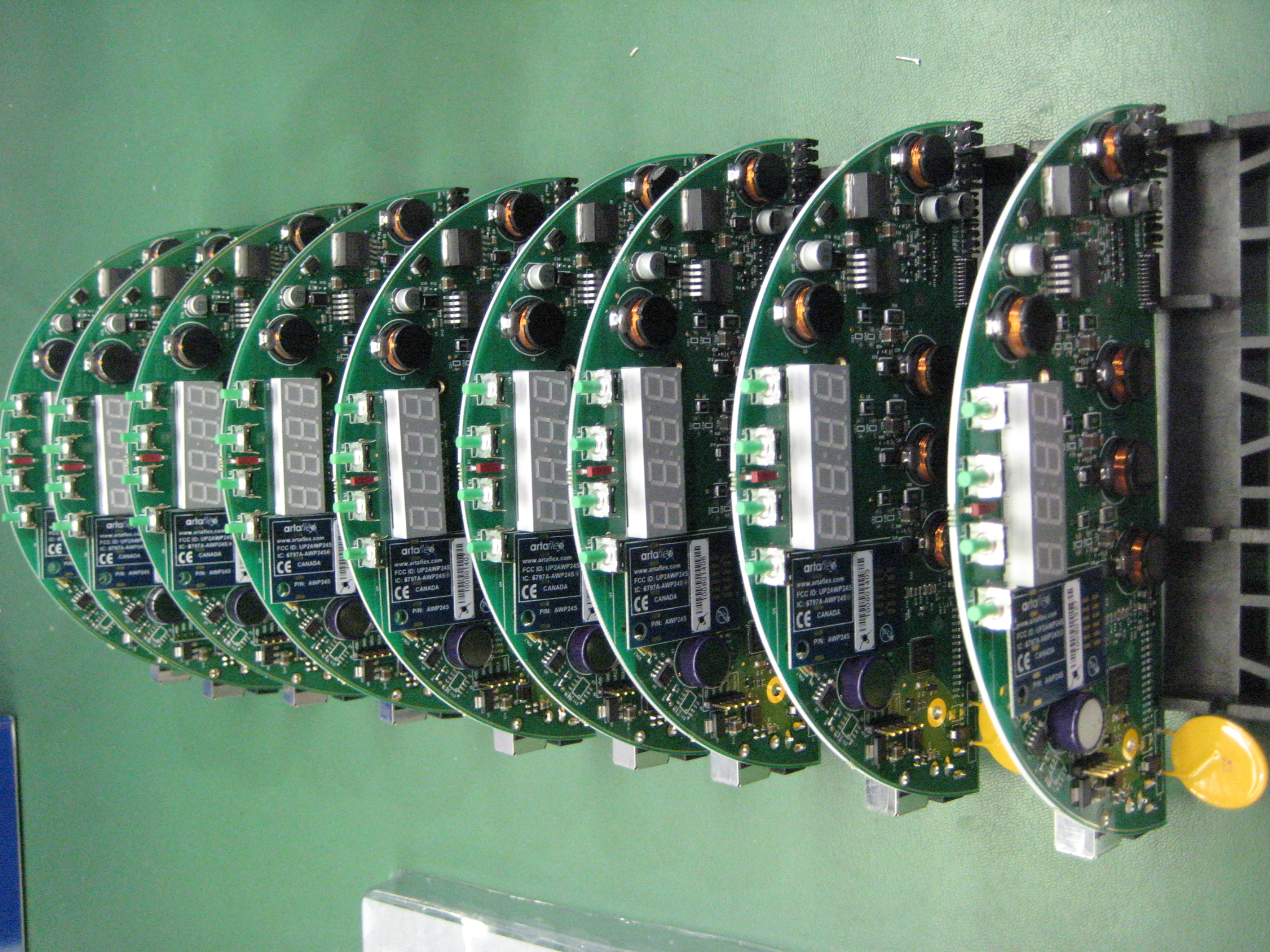 A production run of round PCBs with seven-segment displays